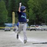 Mariners player Kasen Ludeman scores the game-tying run as he watches where Rory Hayes&rsquo; double lands in the outfield in the top of the sixth inning of the Gastineau Channel Little League Major Division Championship game on Saturday at Miller Field. (Nolin Ainsworth | Juneau Empire)
