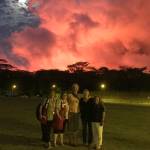 Red Cross Mental Health Service Associate Annie Caulfield, a Juneau resident, stands in the center of a group of fellow Red Cross volunteers as the eruption of the Kilauea Volcano paints the night sky red. (Annie Caulfield | Courtesy Photo)