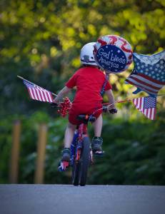Alex Weiss is pictured riding his bike Wednesday, July 4, 2018. The Weiss family believes the bike, which won first place in the boys&rsquo; division of the Most Decorated Bicycle competition, was stolen after the annual Fourth of July parade in Douglas. (Derek Weiss | Courtesy Photo)