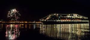 Fireworks set off on shore along with a cruise ship illuminate Juneau&rsquo;s waterfront prior to the city-funded fireworks show in Juneau&rsquo;s downtown Harbor on Tuesday, July 3, 2017. (Michael Penn | Juneau Empire)