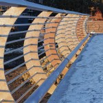 Top: Winter clouds reflected in Mendenhall Lake. Photo by Kerry Howard. Middle: Late afternoon sun lights the railing at the new Statter Harbor parking lot. Photo by Brooke Daly. Bottom: Needle ice forms on the rocks of Echo Cove. Photo by Mary Sutkowski.