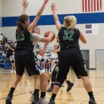 Thunder Mountain High School post Nina Fenumiai eyes the basket through two Colony defenders (Ella Smith, left, and Chole Simpson, right) at Friday night&rsquo;s basketball game at TMHS. (Lance Nesbitt | For the Juneau Empire)