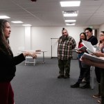 Participants in "Home but not Less" learn their lines. Photo by Ray Friedlander.