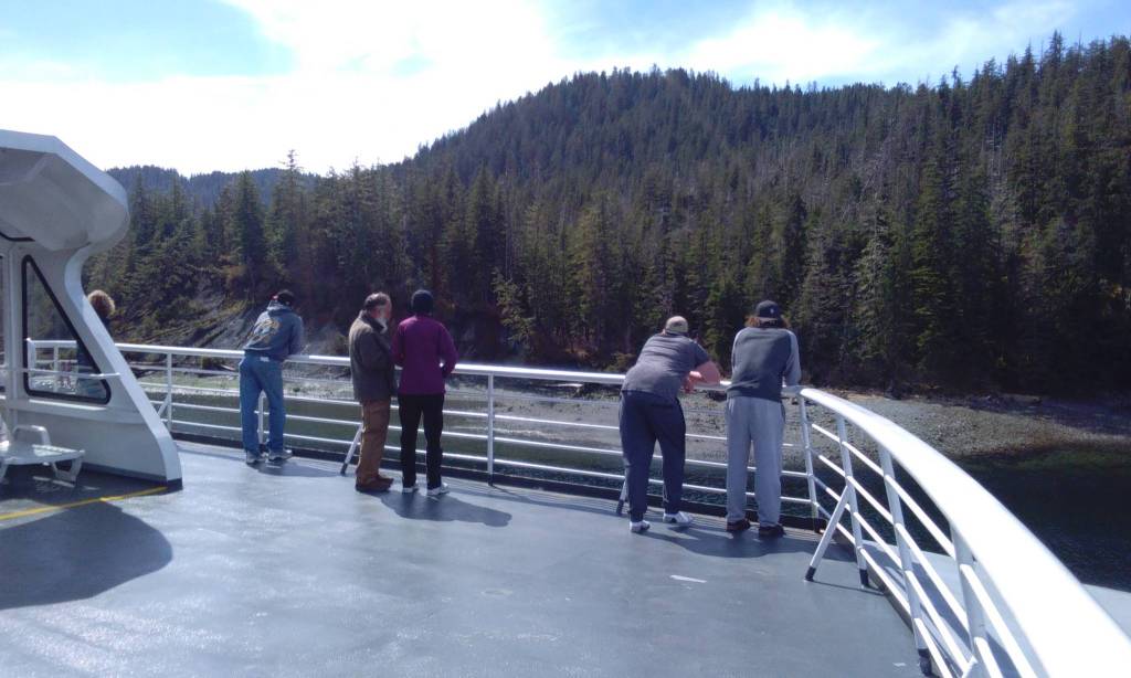 Ben and Diane Adams (center), after helping the author aboard, are awed by how close the ferry gets to the shore while traveling through Sergius Narrows. Tara Neilson | For the Capital City Weekly