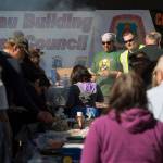 Local union members Kirk Perisch, left, Corey Baxter cook hot dogs and hamburgers for those attending the Labor Day picnic at Sandy Beach on Monday, Sept. 3, 2018. (Michael Penn | Juneau Empire)