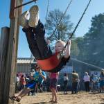 Crystal Koeneman, right, swings her son, Tyr, 6 during the Labor Day picnic at Sandy Beach on Monday, Sept. 3, 2018. (Michael Penn | Juneau Empire)