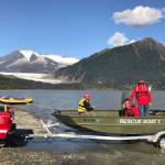 Capital City Fire/Rescue launches their rescue boat to rescue David Hill, of Dallas, Texas, after he capsized in kayak in front of the Mendenhall Glacier on Tuesday, Sept. 4, 2018. (Michael Penn | Juneau Empire)