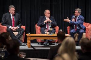 Former U.S. Senator Mark Begich, right, directs a question at former state Senate Mike Dunleavy, left, as Gov. Bill Walker listens during a Juneau Chamber of Commerce luncheon debate at Centennial Hall on Thursday, Sept. 6, 2018. (Michael Penn | Juneau Empire)