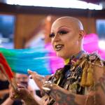 Ricky Tagaban smiles at a Tiny Desk concert at Kindred Post. Tagaban said his work in drag and weaving are both related to gender identity. Photo by Annie Bartholomew.