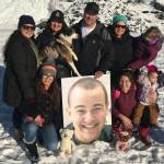 Members of the Eyre family pose at the Mendenhall Glacier with a photograph of Cody Eyre, who was shot and killed by law enforcement on Christmas Eve 2017. (Courtesy Photo | Eyre Family)