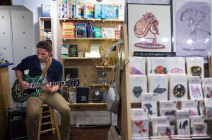 Avery Stewart provides live music at Kindred Post during First Friday on Friday, Sept. 7, 2018. (Michael Penn | Juneau Empire)