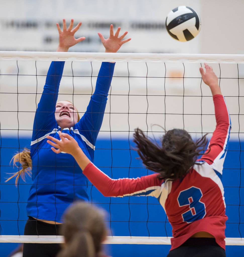 Thunder Mountains Alexandrea Murray, left, attempts to block against Sitkas Miah Dumag at Thunder Mountain High School on Friday, Sept. 7, 2018. Thunder Mountain won 3-0 (25-15, 25-21, 25-16) (Michael Penn | Juneau Empire)