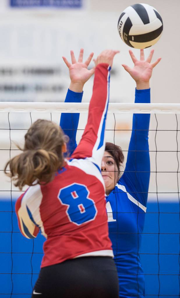 Thunder Mountains Letasiilemilion Fenumiai, right, attempts to block Sitkas Avery Voron at Thunder Mountain High School on Friday, Sept. 7, 2018. Thunder Mountain won 3-0 (25-15, 25-21, 25-16) (Michael Penn | Juneau Empire)