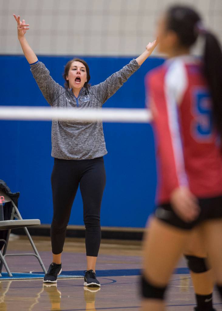 Thunder Mountain head coach Julie Herman celebrates a point against Sitka at Thunder Mountain High School on Friday, Sept. 7, 2018. Thunder Mountain won 3-0 (25-15, 25-21, 25-16) (Michael Penn | Juneau Empire)