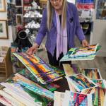 Devita Stipek Writer talks about her murals and other paintings that are now gracing Carnival Cruise ships. Writer, a member of the Juneau Artist Gallery co-op, was interviewed there on Tuesday, Sept. 11, 2018. (Michael Penn | Juneau Empire)