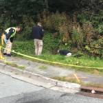 Juneau Police Department officers search near the intersection Blackerby Street and Glacier Highway on Thursday, Sept. 13, 2018. (Alex McCarthy | Juneau Empire)