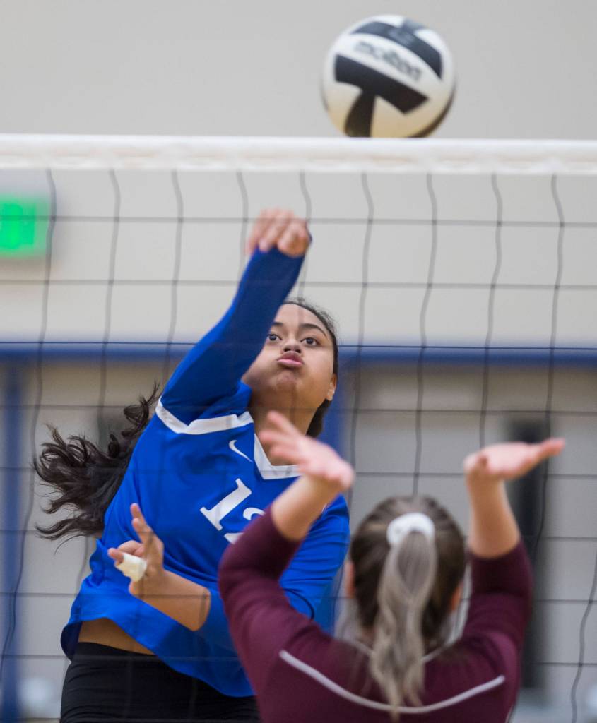 Thunder Mountains Mariah Tanuvasa-Tuvaifale spikes the ball against Ketchikans Autumn Yeisley at TMHS on Friday, Sept. 14, 2018. TMHS won 3-0. (Michael Penn | Juneau Empire)