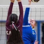 Thunder Mountains Lexi Murry, right, spikes the ball against Ketchikans Madison Purcell at TMHS on Friday, Sept. 14, 2018. TMHS won 3-0. (Michael Penn | Juneau Empire)
