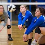Thunder Mountains Audrey Welling, center, bumps the ball up against Ketchikan backed up by teammates Tasi Fenumiai, right, and Leilani Eshnaur at TMHS on Friday, Sept. 14, 2018. TMHS won 3-0. (Michael Penn | Juneau Empire)