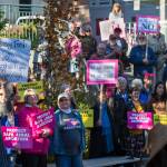 Juneau residents participate in a protest against President Donald Trumps nominee to the Supreme Court, Brett Kavanaugh, at Dimond Courthouse Plaza on Tuesday, Sept. 18, 2018. (Michael Penn | Juneau Empire)