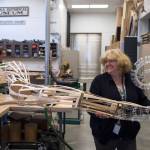 Alaska State Libraries, Archives and Museums Operation Manager Lisa Golisek-Nankerv, right, helps Museum Exhibit Specialist Aaron Elmore move one of the eight legs to a giant octopus he is building for the Museums childrens room on Monday, Sept. 17, 2018. (Michael Penn | Capital City Weekly)