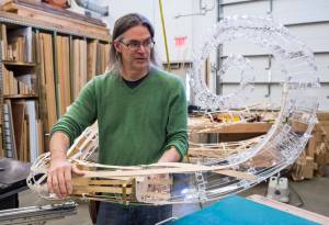 Exhibit Specialist Aaron Elmore positions one of the eight legs for a giant octopus he is building for the Alaska State Museums childrens room on Monday, Sept. 17, 2018. (Michael Penn | Capital City Weekly)