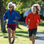 Merry Ellefson runs with her son, Arne Ellefson-Carnes, during Juneau-Douglas High School cross country practice on Wednesday, Sept. 19, 2018. Merry is a co-coach for the team and Arne is a senior. (Michael Penn | Juneau Empire)