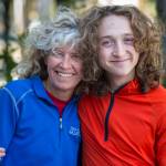 Merry Ellefson with her son, Arne Ellefson-Carnes, during Juneau-Douglas High School cross country practice on Wednesday, Sept. 19, 2018. Merry is a co-coach for the team and Arne is a senior. (Michael Penn | Juneau Empire)