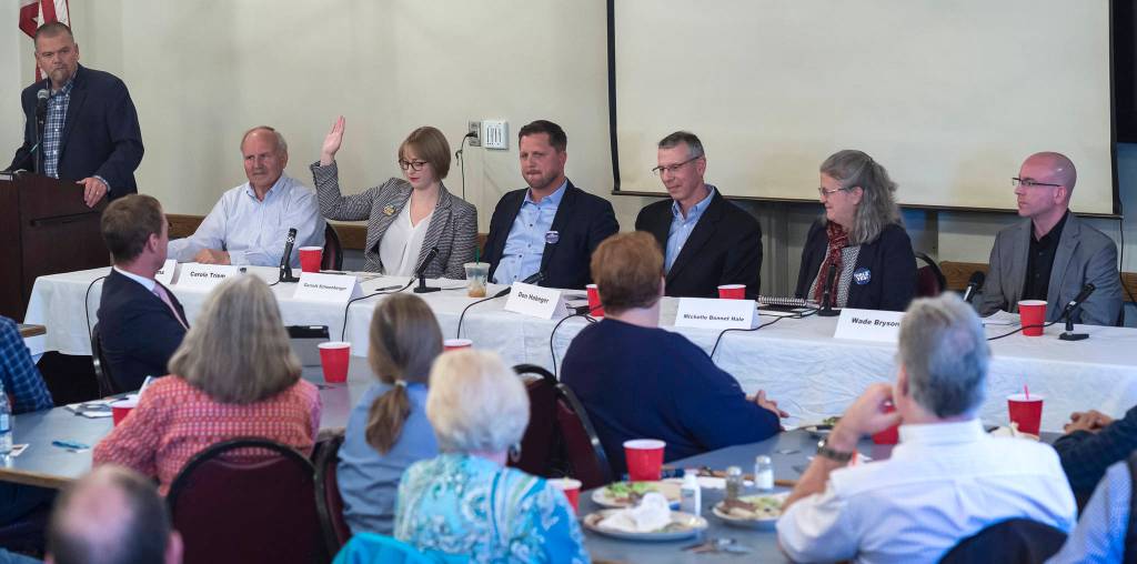 Juneau Assembly candidates for the Areawide and District 2 seats are asked to raise their hand if they support Ballot Measure 1, Stand for Salmon, during a forum at the Juneau Chamber of Commerce during its weekly luncheon at the Moose Lodge on Thursday, Sept. 20, 2018. District 2 candidate Emil Mackey did not attend the event because of work travel. (Michael Penn | Juneau Empire)