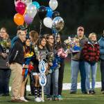 Family and friends celebrate senior night with cheerleaders and players before Juneau Uniteds game against Colony at Thunder Mountain High School on Friday, Sept. 21, 2018. (Michael Penn | Juneau Empire)