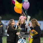 Family and friends celebrate senior night with cheerleaders and players before Juneau Uniteds game against Colony at Thunder Mountain High School on Friday, Sept. 21, 2018. (Michael Penn | Juneau Empire)