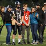 Family and friends celebrate senior night with cheerleaders and players before Juneau Uniteds game against Colony at Thunder Mountain High School on Friday, Sept. 21, 2018. (Michael Penn | Juneau Empire)