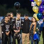 Family and friends celebrate senior night with cheerleaders and players before Juneau Uniteds game against Colony at Thunder Mountain High School on Friday, Sept. 21, 2018. (Michael Penn | Juneau Empire)