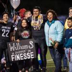 Family and friends celebrate senior night with cheerleaders and players before Juneau Uniteds game against Colony at Thunder Mountain High School on Friday, Sept. 21, 2018. (Michael Penn | Juneau Empire)