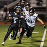 Juneau Uniteds Hansel Hinckle, left, is chased by Colonys Isaac Richardson at Thunder Mountain High School on Friday, Sept. 21, 2018. (Michael Penn | Juneau Empire)