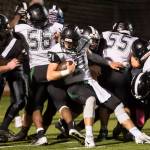 Colonys quarterback Eric Christy pushes his way into the end zone against Juneau United at Thunder Mountain High School on Friday, Sept. 21, 2018. The touchdown was called back because of a penalty. (Michael Penn | Juneau Empire)