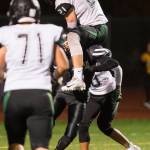 Colonys quarterback Eric Christy hurtles a Juneau United player for a touchdown at Thunder Mountain High School on Friday, Sept. 21, 2018. The touchdown was called back because of a penalty. (Michael Penn | Juneau Empire)