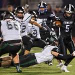 Juneau Uniteds Hansel Hinckle is tackled behind the line of scrimmage by Colonys Trace Severson at Thunder Mountain High School on Friday, Sept. 21, 2018. (Michael Penn | Juneau Empire)