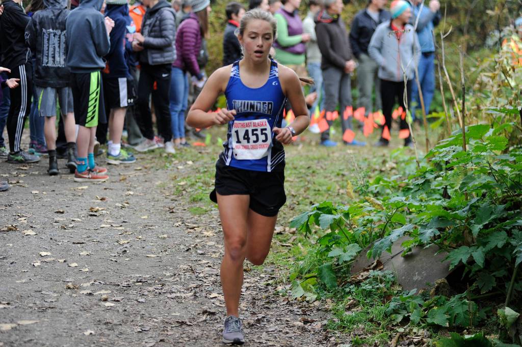Thunder Mountains Kiah Dihle runs in the Region V Cross Country Championship meet on Saturday. (Nolin Ainsworth | Juneau Empire)