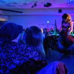 Mary Folletti Cruise and her daughter, Enza, watch drag queen Lituya Hart during the Besties 4 Breasties drag show fundraiser that benefitted Folletti Cruise, who has been diagnosed with Stage 3 breast cancer. In a few weeks, she will travel to Seattle for treatment. (Ben Hohenstatt | Capital City Weekly)