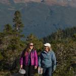 Erin Anais Heist, left, and her mother, Kate Troll, walk to pick high-bush cranberries on Douglas Island on Thursday, Sept. 20, 2018. (Michael Penn | Juneau Empire)