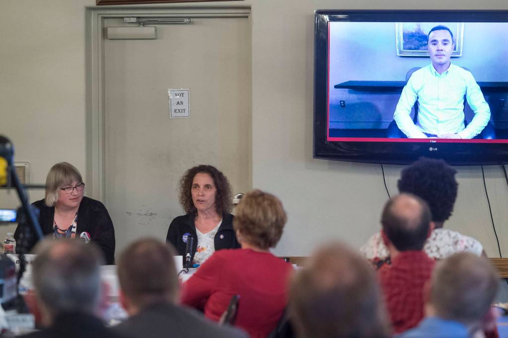 Juneau mayoral candidates Beth Weldon, left, Saralyn Tabachnick and Norton Gregory, via video conference, speak to the Juneau Chamber of Commerce during its weekly luncheon at the Moose Lodge on Thursday, Sept. 27, 2018. (Michael Penn | Juneau Empire)