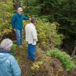 Alan Steffert, project manager for the city, shows City Manager Rorie Watt and Win Gruening Middle Creek from the end of the newly opened West Douglas Pioneer Road after a ribbon cutting ceremony on Friday, Sept. 28, 2018. (Michael Penn | Juneau Empire)