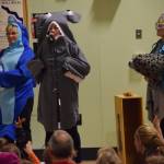 National Oceanic and Atmospheric Administration employees Kim Raum-Suryan, left, Alicia Schuler, middle, and Aleria Jensen speak to Sayeik Gastineau Community School students about ocean conservancy on Friday, Sept. 28, 2018. Gastineau is one of two Juneau schools to start an Ocean Guardian program, which will work to clean up local shorelines and advocate for ocean issues. (Kevin Gullufsen | Juneau Empire)