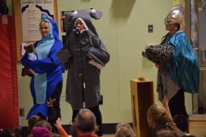 National Oceanic and Atmospheric Administration employees Kim Raum-Suryan, left, Alicia Schuler, middle, and Aleria Jensen speak to Sayeik Gastineau Community School students about ocean conservancy on Friday, Sept. 28, 2018. Gastineau is one of two Juneau schools to start an Ocean Guardian program, which will work to clean up local shorelines and advocate for ocean issues. (Kevin Gullufsen | Juneau Empire)
