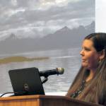 Katy Giorgio, president for Orpheus Project and producer for the upcoming Princess Sophia opera, speaks in front of a slide of Vanderbilt Reef, where the Princess Sophia sunk in 1918. The opera, which opens on the 100th anniversary of the wreck that claimed at least 350 lives, was the subject of an Evening at Egan lecture series talk. (Ben Hohenstatt | Capital City Weekly)