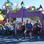 Children run into Project Playground during a grand reopening at Twin Lakes on Saturday, Sept. 29, 2018. (Kevin Gullufsen | Juneau Empire)