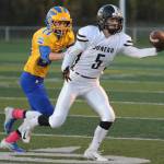 Juneaus Hansel Hinckle reaches for a pass as Bartlett defender Josh Siania closes in at Chugiak High School in Anchorage on Saturday, Sept. 29. Bartlett won 65-12. (Michael Dinneen | For the Juneau Empire)