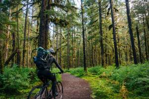 Katie McCaffrey racing the Herbert Glacier Trail. (Gabe Donohoe | For the Juneau Empire)