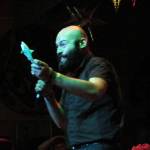 Seth Santana, vocalist for Before Youre Nothing, holds up a plastic shark during the Fall Freakshow metal concert at the JACC. The toy shortly thereafter was tossed into the audience. (Ben Hohenstatt | Capital City Weekly)